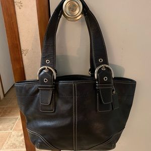 I’m selling black leather original coach purse.